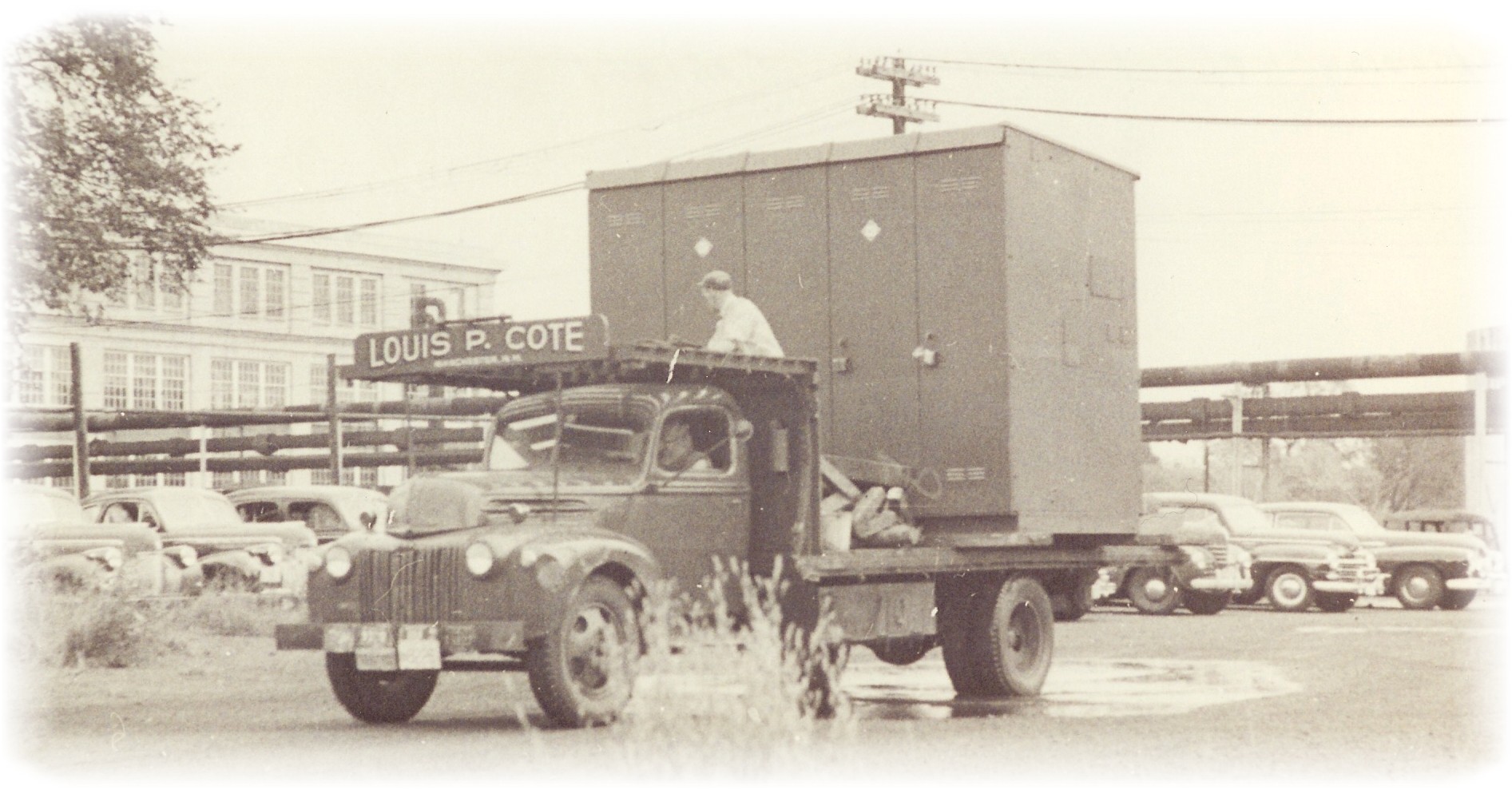 Louis P. Cote, Inc. transporting an over width switchgear assembly in the 1950s