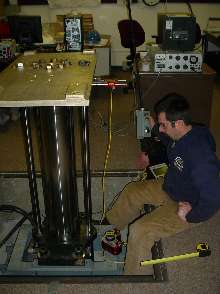 Louis P. Cote, Inc. millwright installs a laser system for a defense contractor.