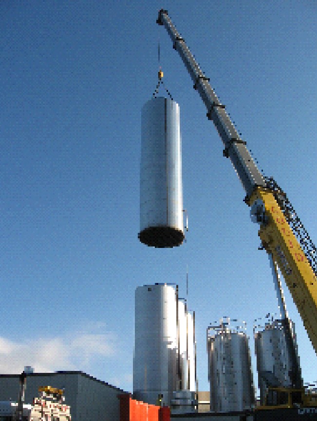 Louis P. Cote, Inc. uses a crane to hoist a storage silo.