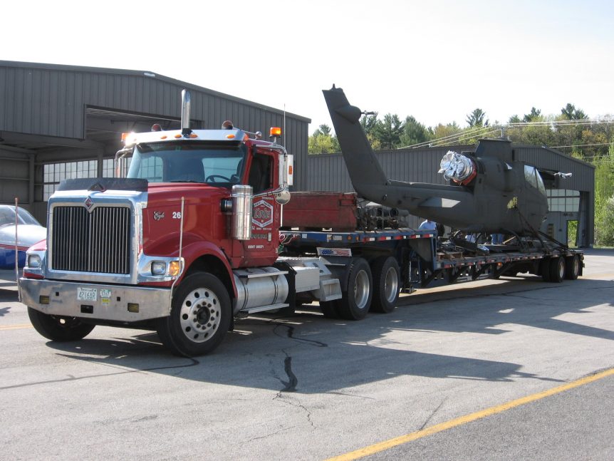 Louis P. Cote, Inc.'s heavy haul truckers prepare to transport a military helicopter.