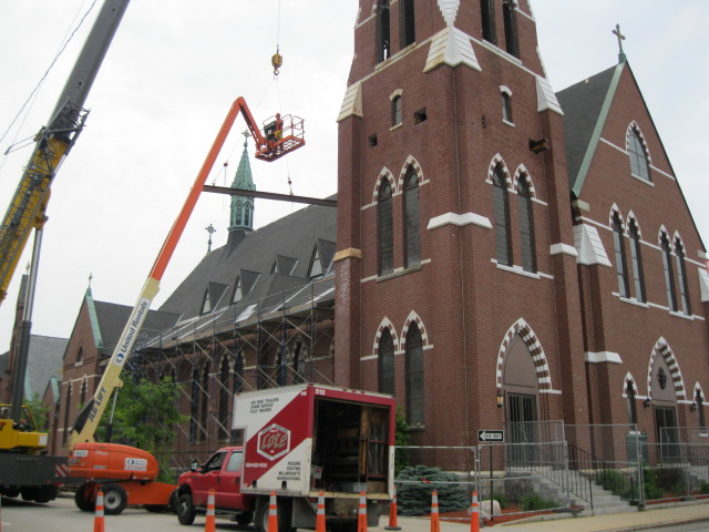 Louis P. Cote, Inc.'s riggers work with a crane and telescopic man lift to preform repairs at Saint Marie Parish in Manchester NH.