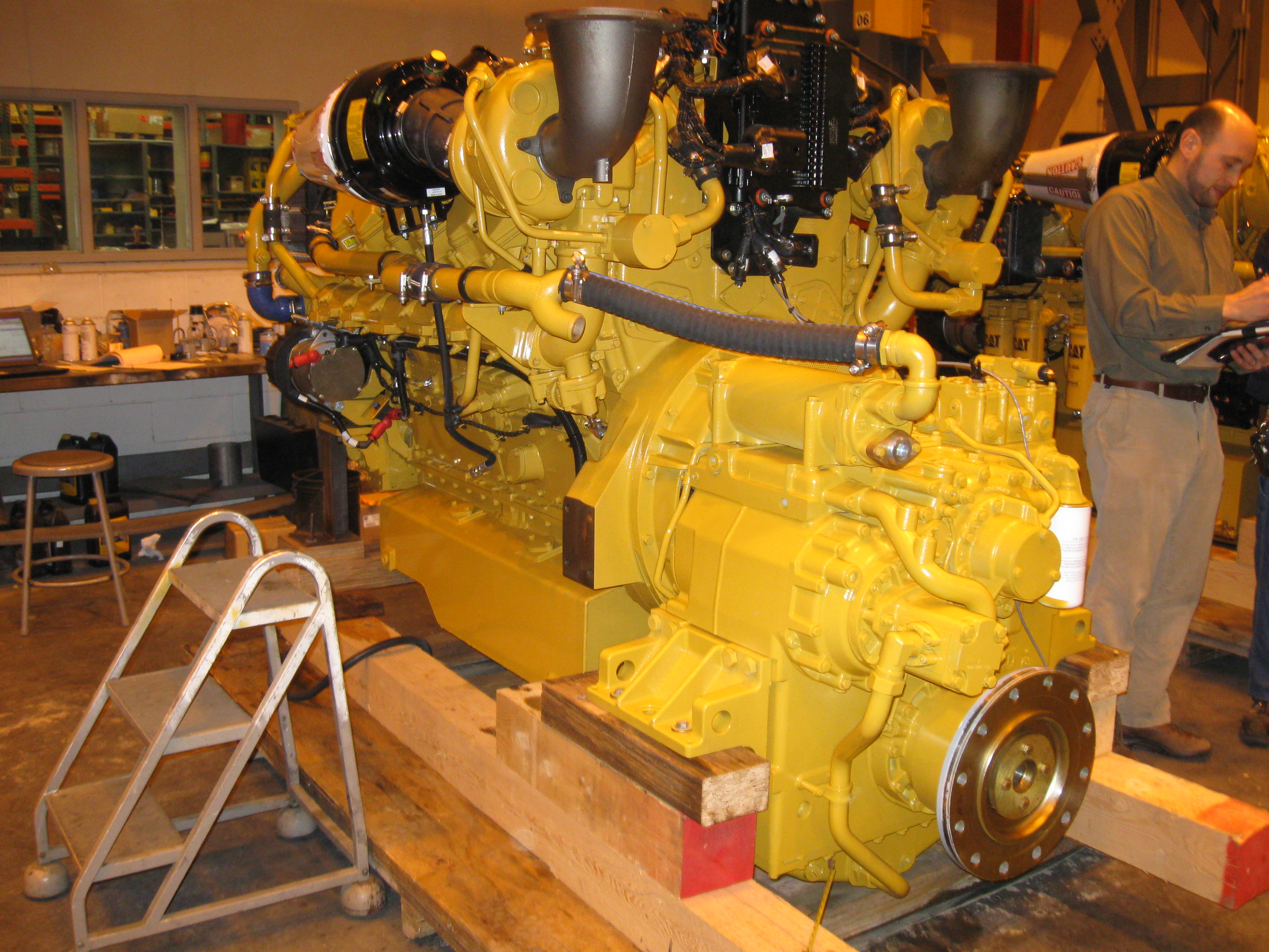 A new Cat engine is inspected prior to transport by Louis P. Cote, Inc.