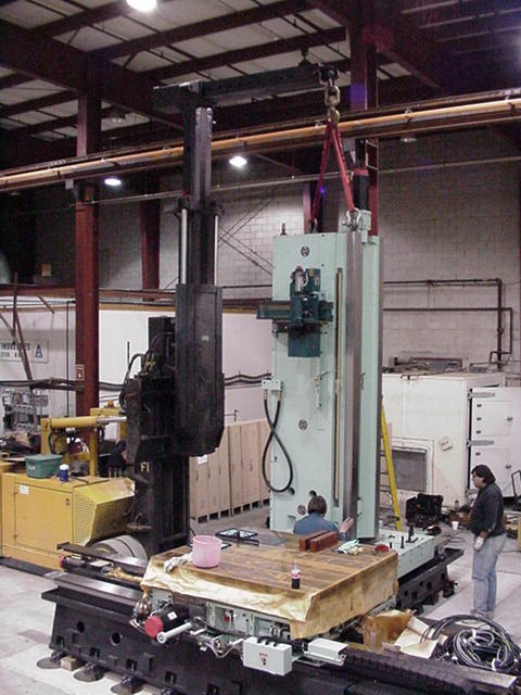 Louis P. Cote, Inc.'s millwrights install a piece of heavy machinery at a client's facility.
