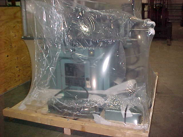 A piece of machinery is palleted and shrink wrapped in preparation for shipping by Louis P. Cote, Inc.'s crating division at it's Goffstown NH warehouse.