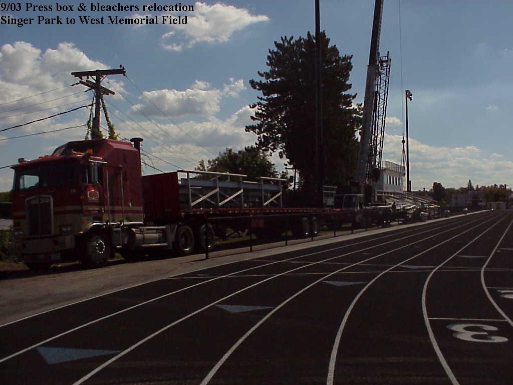Louis P. Cote, Inc.'s heavy haul truckers deliver the bleachers and press box to Manchester NH's West High School's new track and field stadium in 2003.
