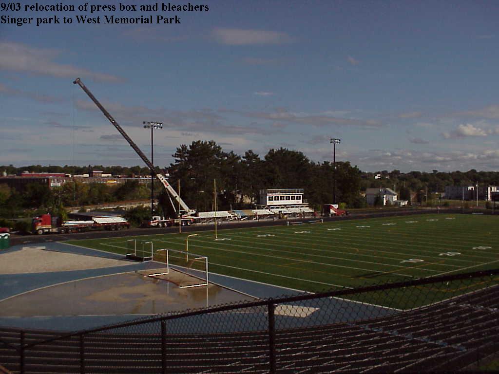 Louis P. Cote, Inc.'s crane hoists the bleachers and press box into place at Manchester NH's West High School's new track and field stadium in 2003.